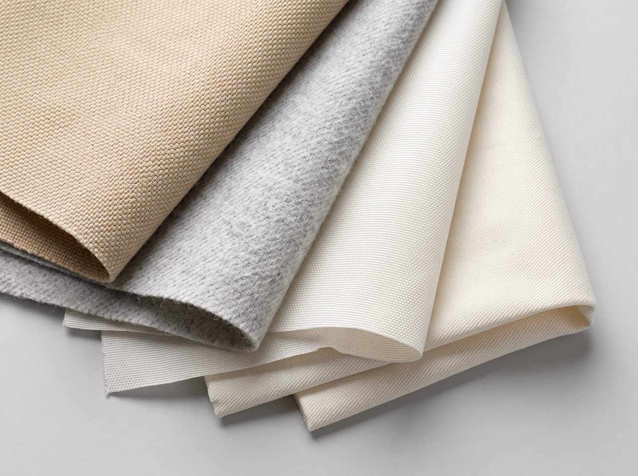 Swatches of woven filter fabrics including sateen, canton flannel and duck cloth